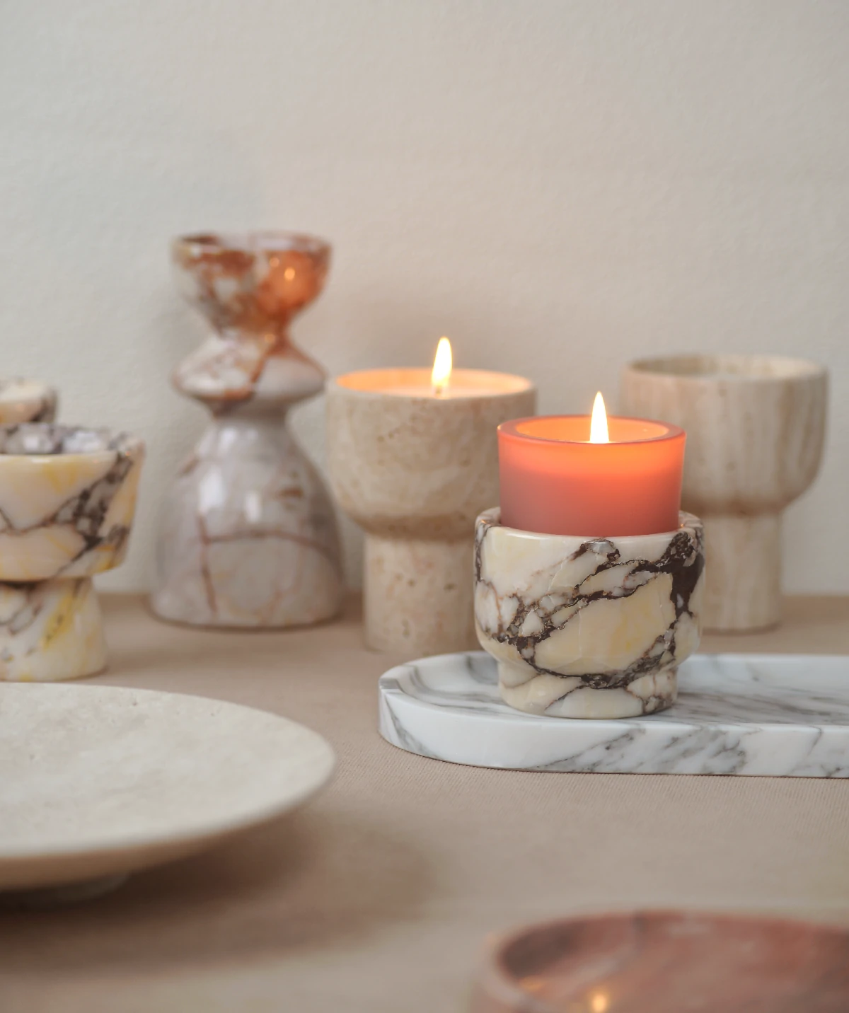 Handcrafted natural stone candle holders showing varied colours and patterns.