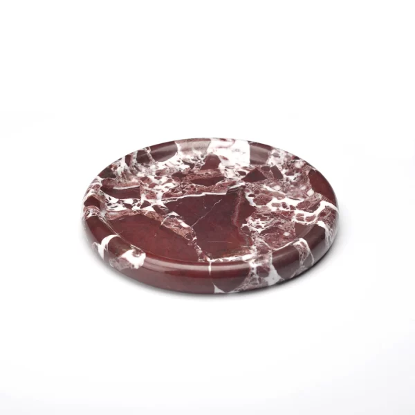 Round burgundy marble tray with prominent white veining and deep red patches, polished for a refined look.