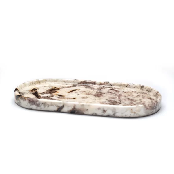 Close-up of the Oval Patagonia Blanc Stone Tray, highlighting its smooth surface, natural veining, and crystal accents.