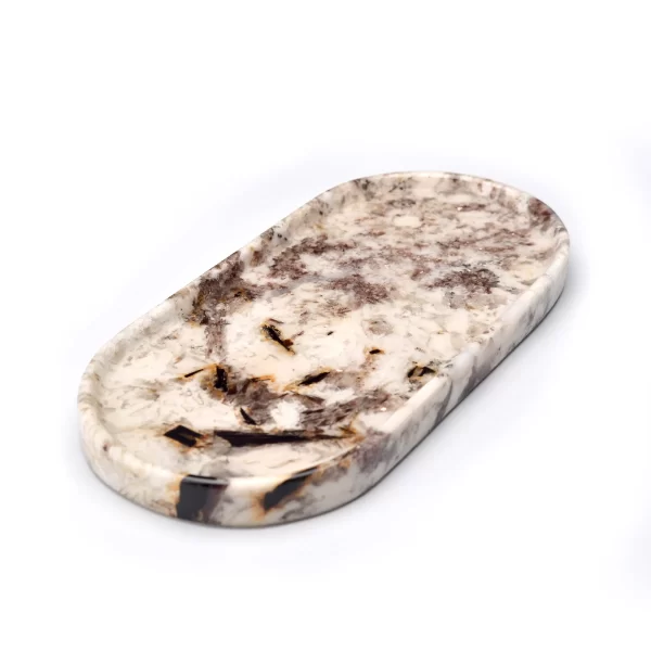 Detailed shot of the Oval Patagonia Blanc Stone Tray with visible brown and beige veins, crystalline texture, and glossy glaze finish.