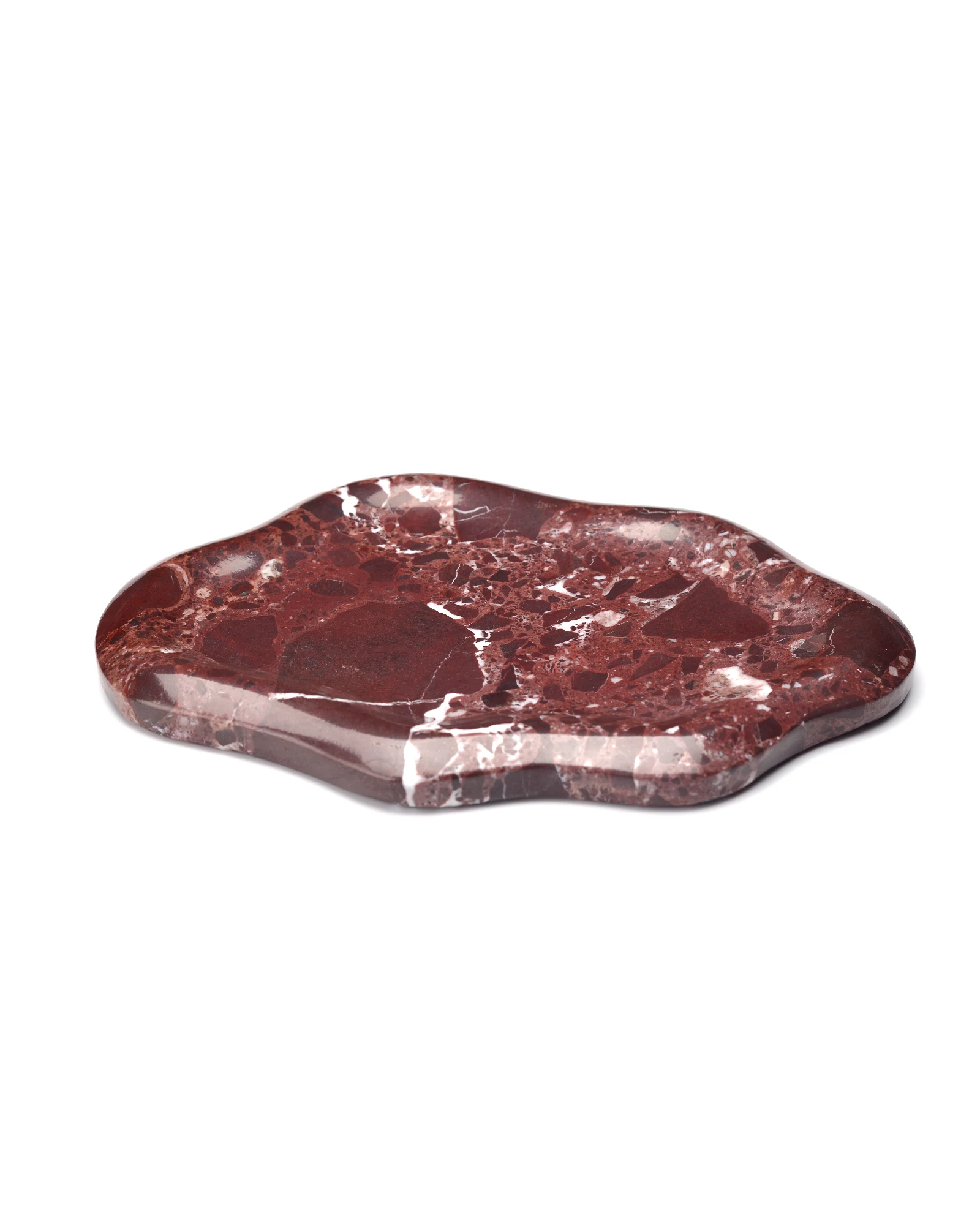 Side view of the Cloud Irregular Burgundy Marble Tray, showcasing the elegant curved edges and the natural red and white veining of the marble.