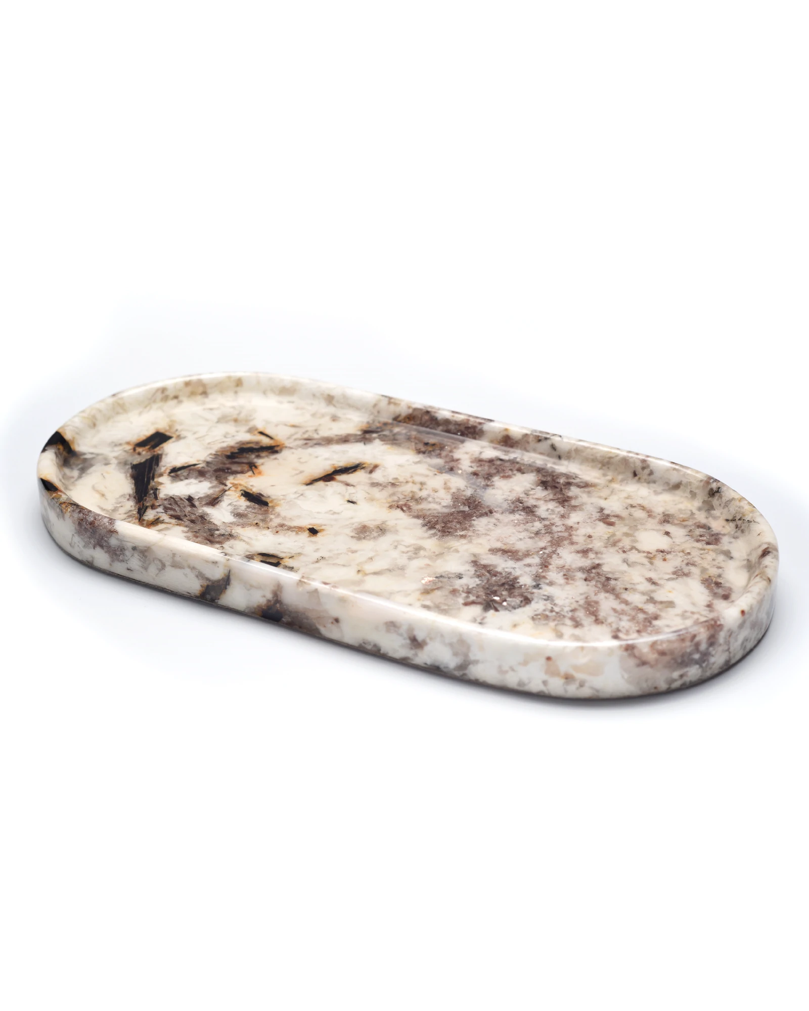 Angled view of stone tray with crystals sparkling under light