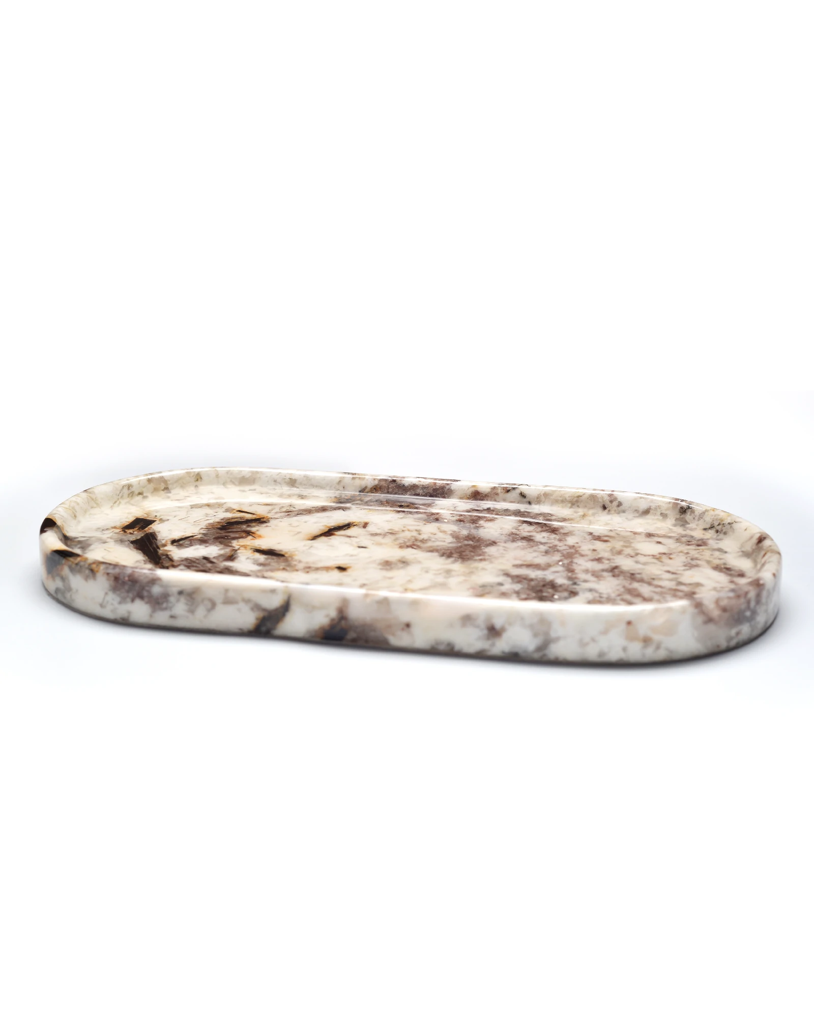 Oval stone tray with glossy glaze reflecting light