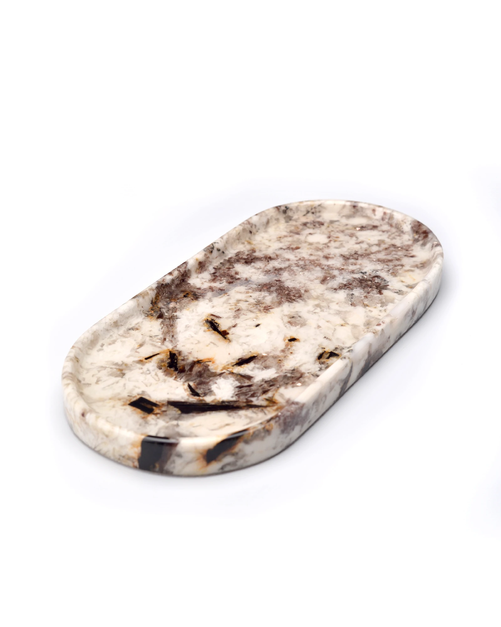 Close-up of Patagonia Blanc stone showing brown, orange, and cream veining