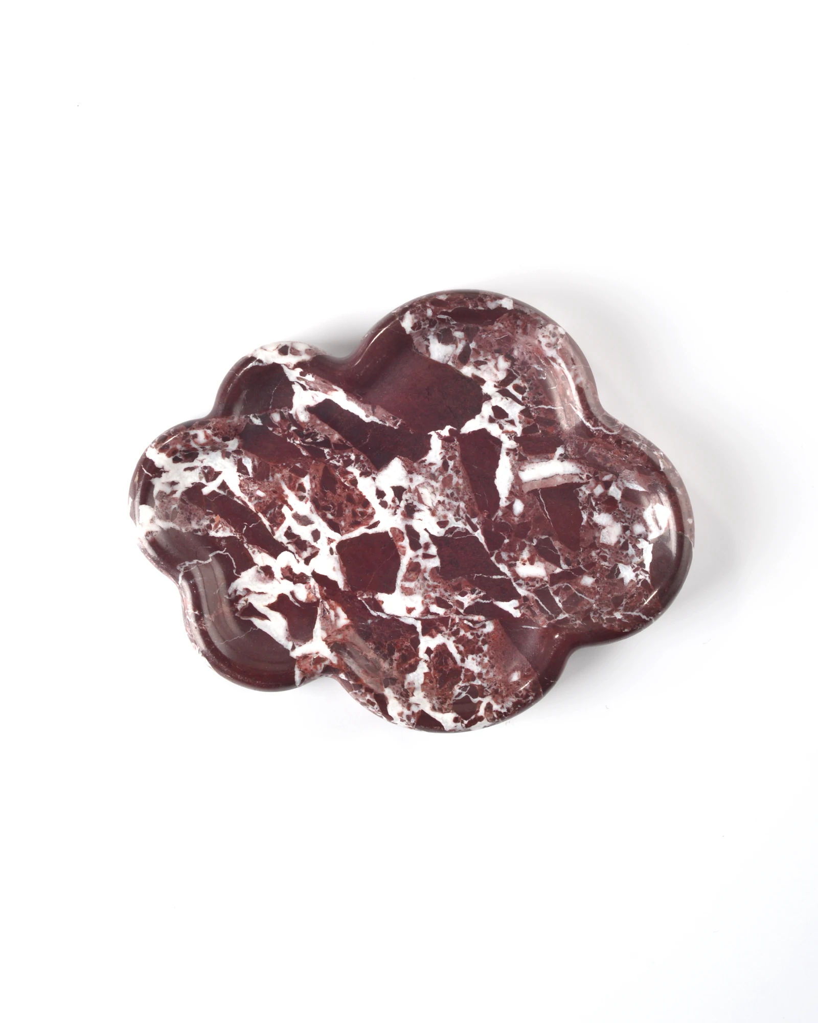 The Cloud Irregular Burgundy Marble Tray with curved edges, smooth polished finish, and natural red and white stone veining