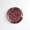 Overhead detail of Round Burgundy Marble Tray with polished surface and rich red color blocks
