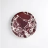 Top view of polished Round Burgundy Marble Tray with natural red and white marble patterns