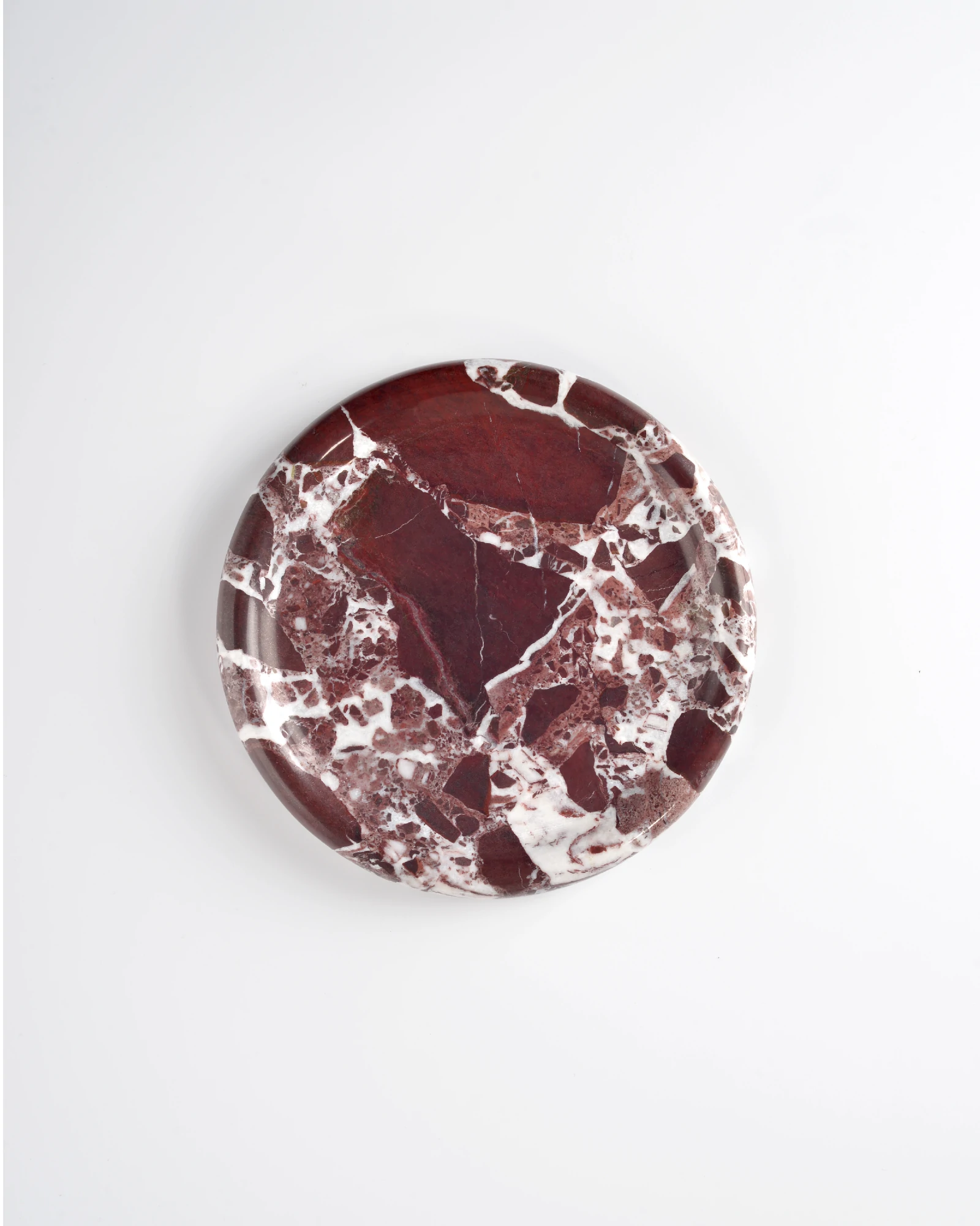 Top view of polished Round Burgundy Marble Tray with natural red and white marble patterns