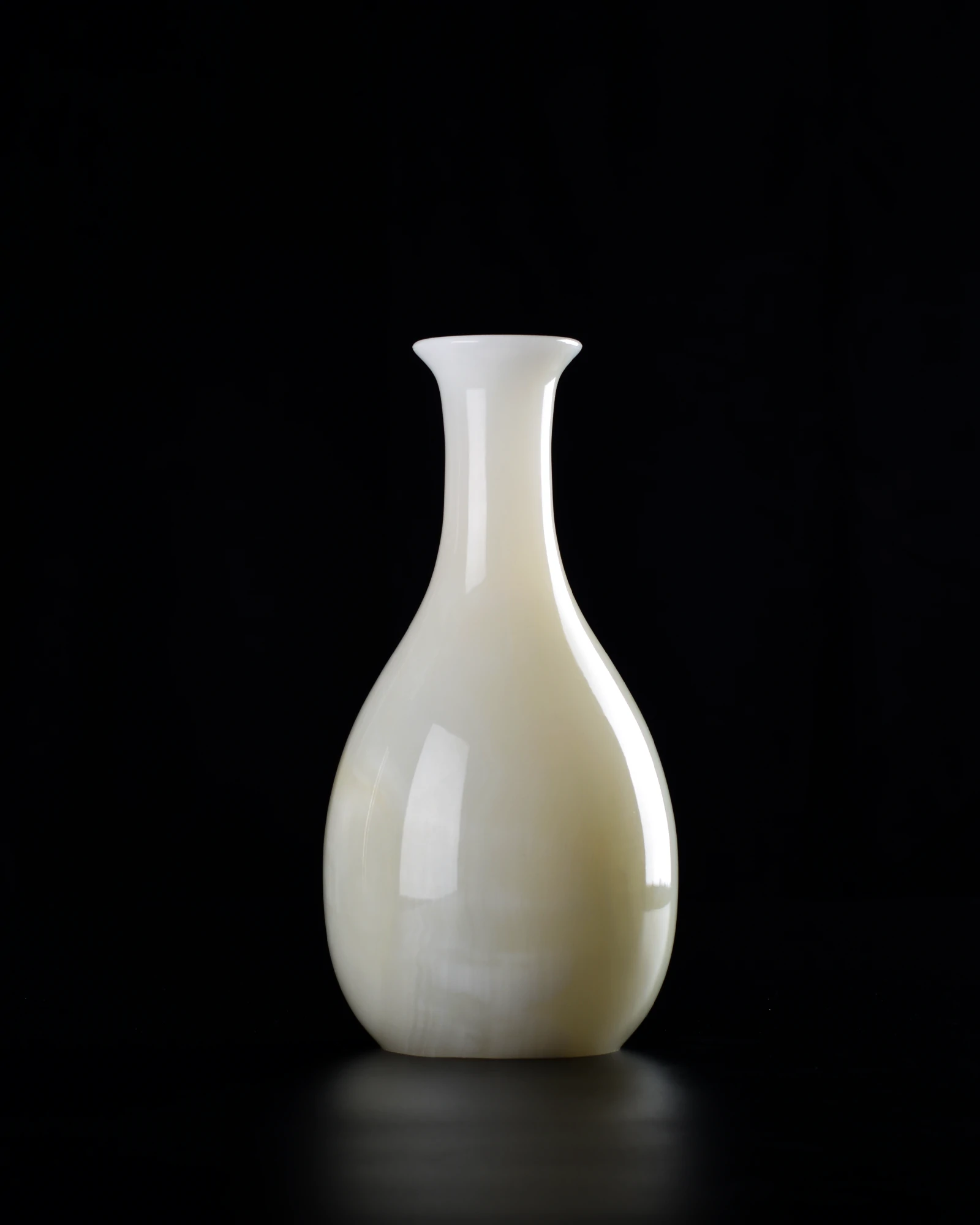 White onyx vase with layered, translucent texture