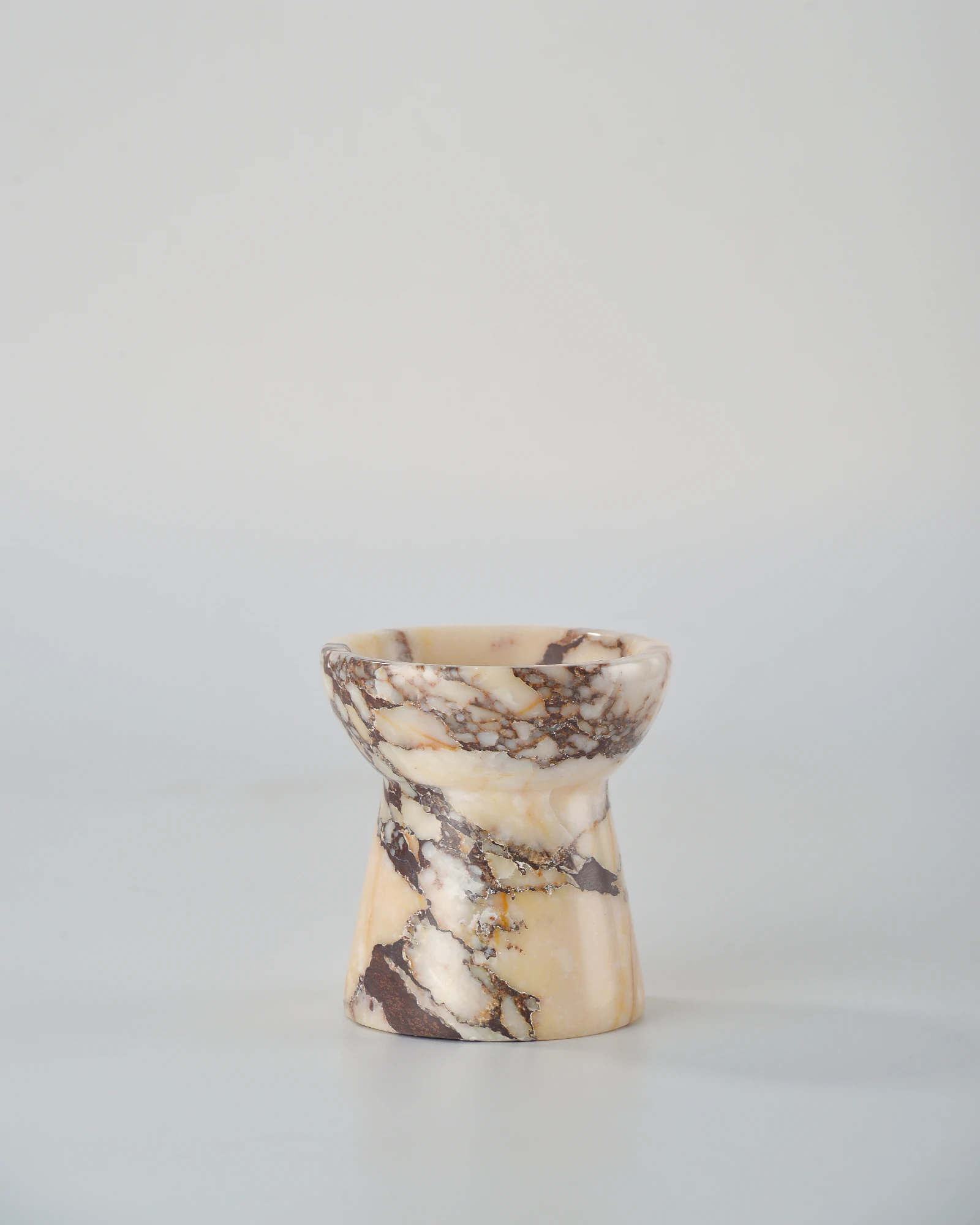 Handcrafted small Calacatta Marble candle holder in the shape of a torch, highlighting natural marble veins