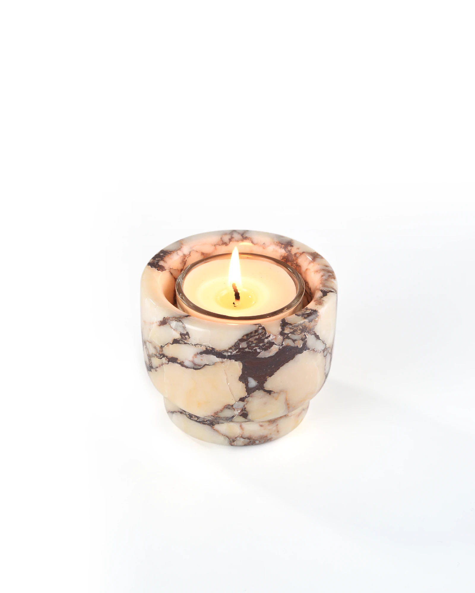 Minimalist Calacatta Marble candle holder with a lit candle, elegant and compact home decor