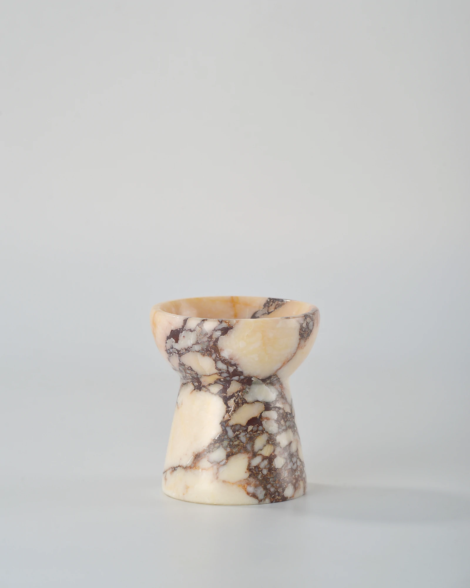 Compact Calacatta Marble candle holder shaped like a small torch, a beautiful and functional home decor piece