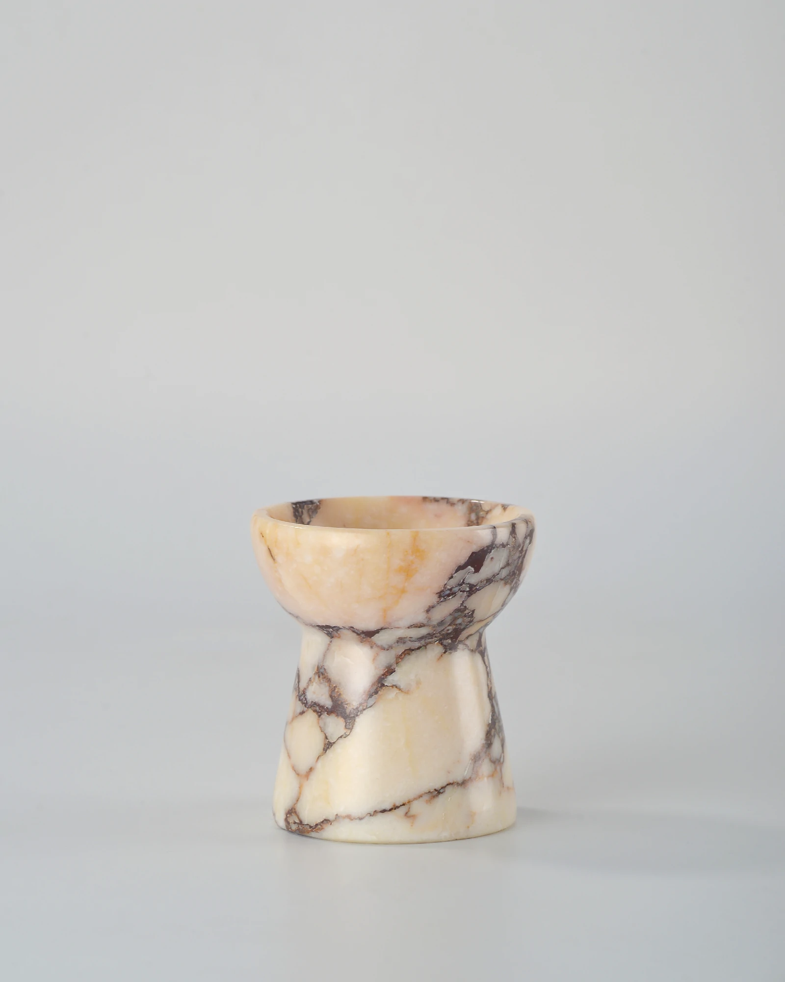 Handcrafted Calacatta Marble small candle holder, designed in the shape of a torch, a refined decor piece