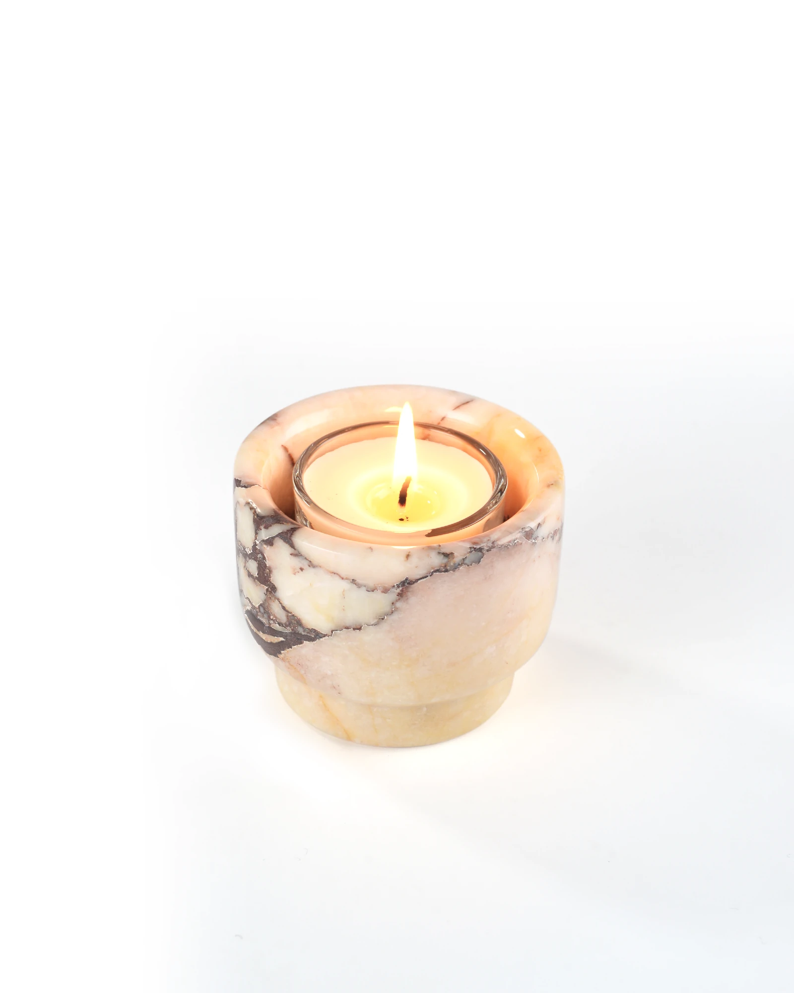Minimalist Calacatta Marble candle holder with a lit candle, elegant and compact home decor