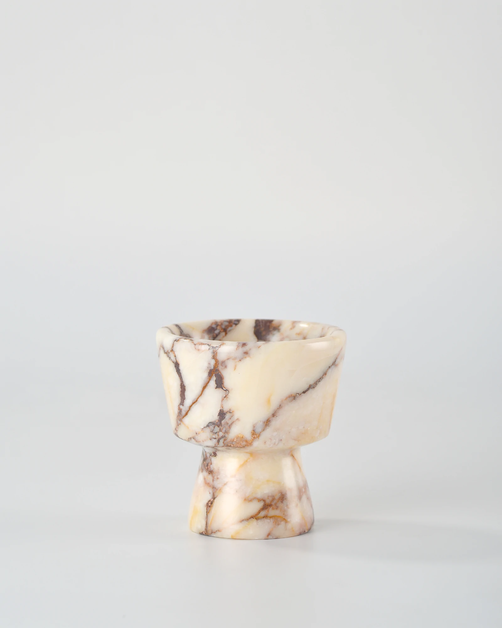 Handcrafted Calacatta Marble candle holder inspired by classic geometric shapes, featuring subtle gray veining, a delicate home decor piece