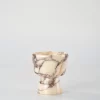 Calacatta Marble candle holder with intricate brown-red veining on beige stone, inspired by geometric shapes