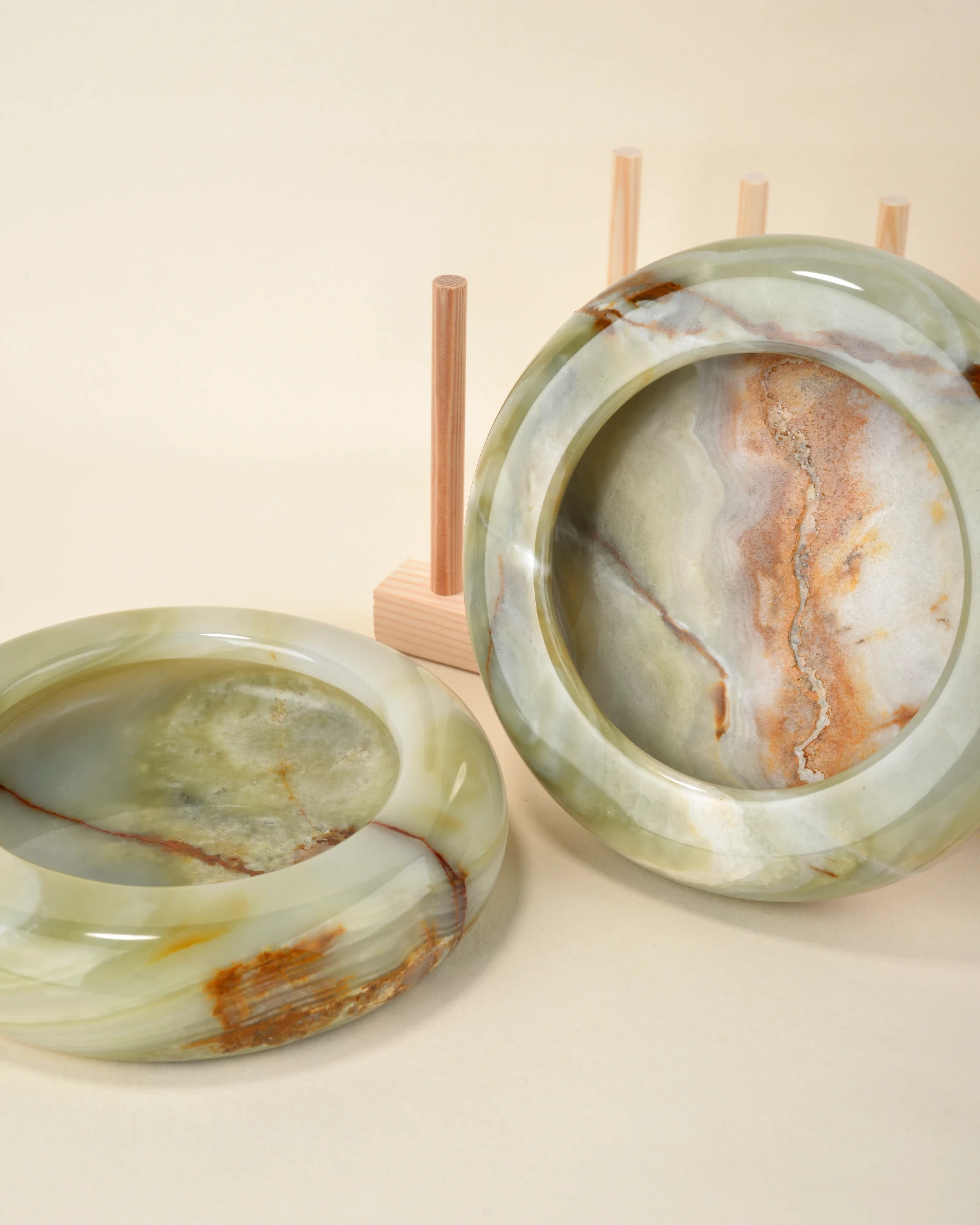 Several elegant, polished Round Green Onyx Ashtrays for Cigar and Cigarette Smokers displayed on a tabletop