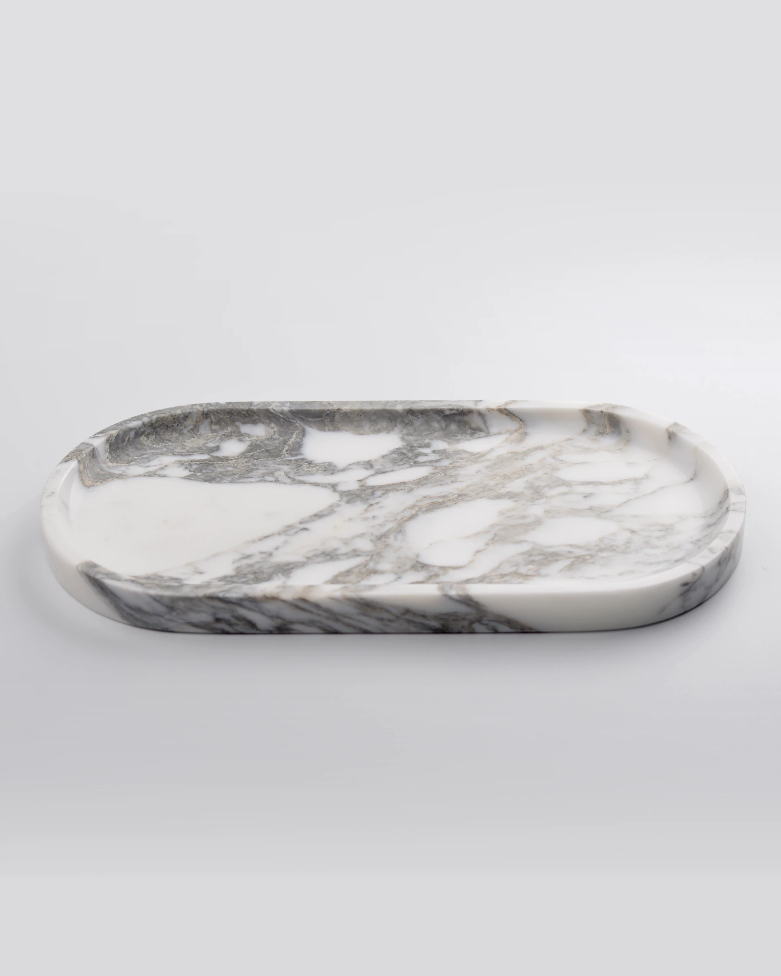 Light-polished oval White with Grey Veins Marble Tray, classic minimalist design