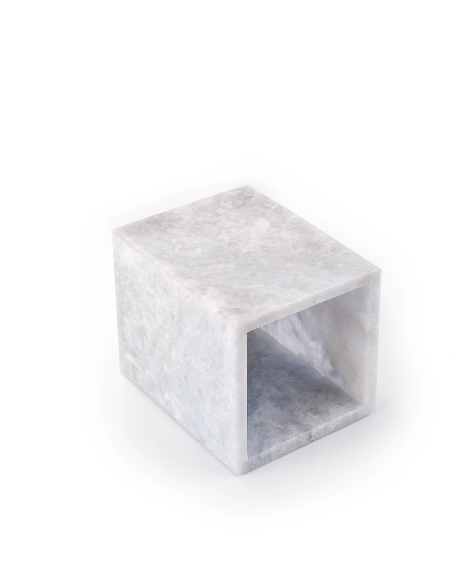 Blueish Crystal Marble Candle Holder laid on its side, showing the cup-shaped cavity depth