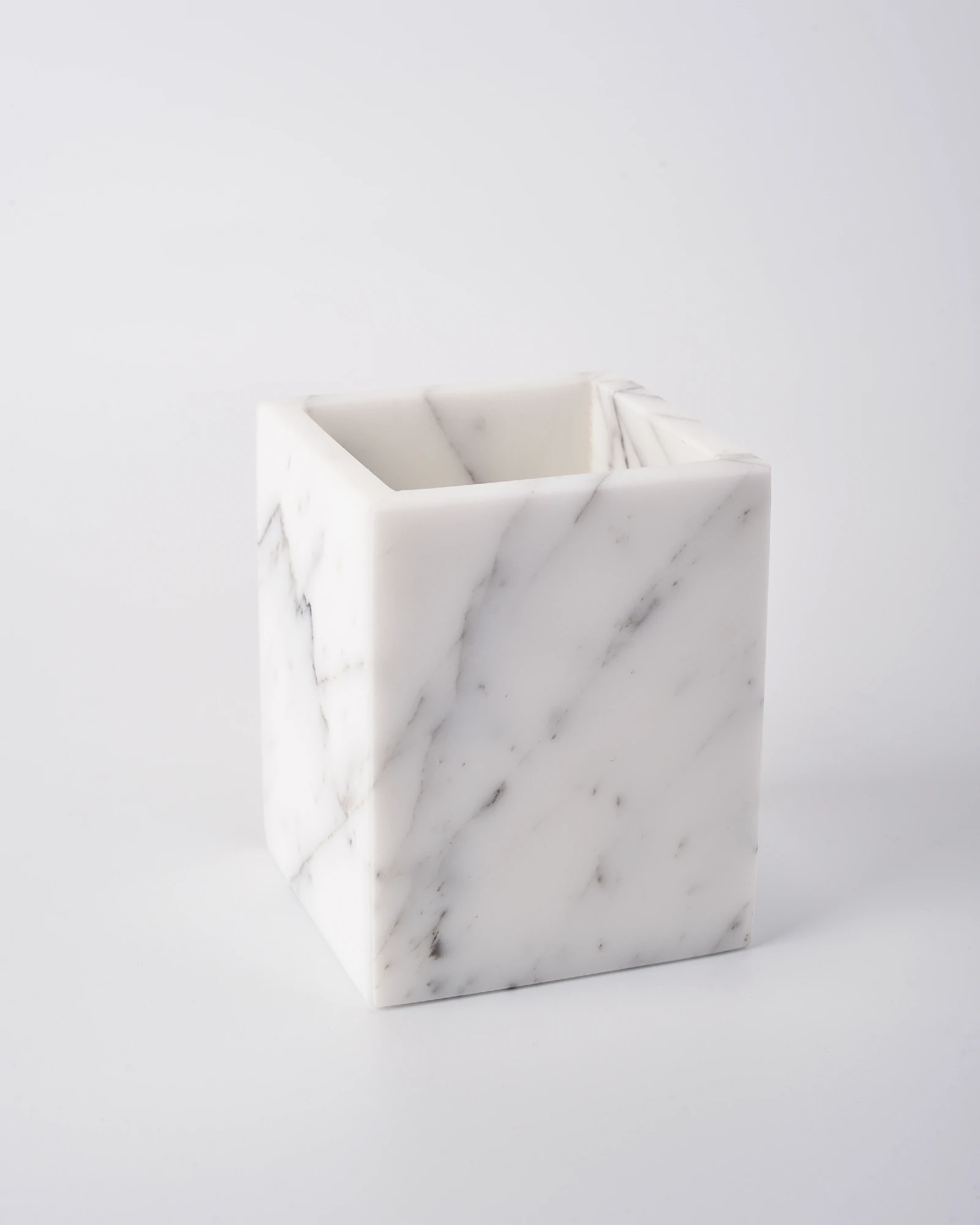 Side view of marble candle holder showing contrasting marble textures