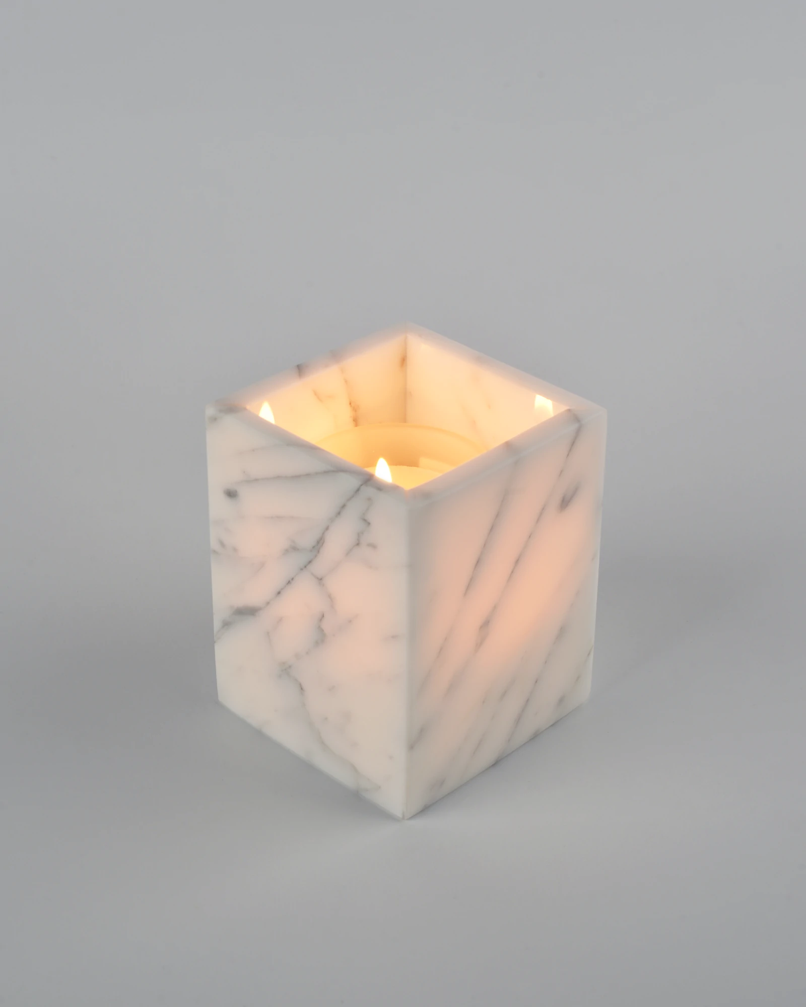 Candlelight glowing through marble reveals veining details