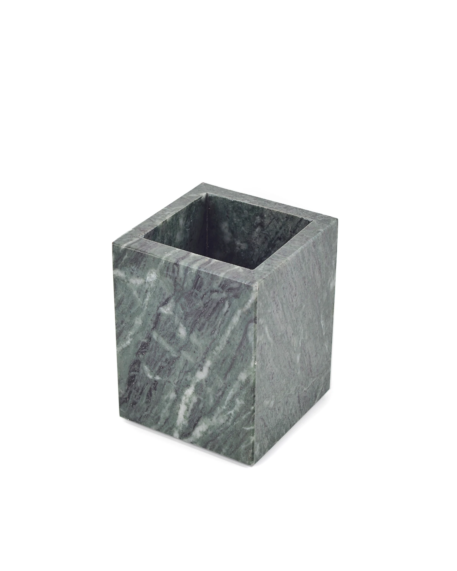 Close-up of green marble candle holder with mist-like black and white veining