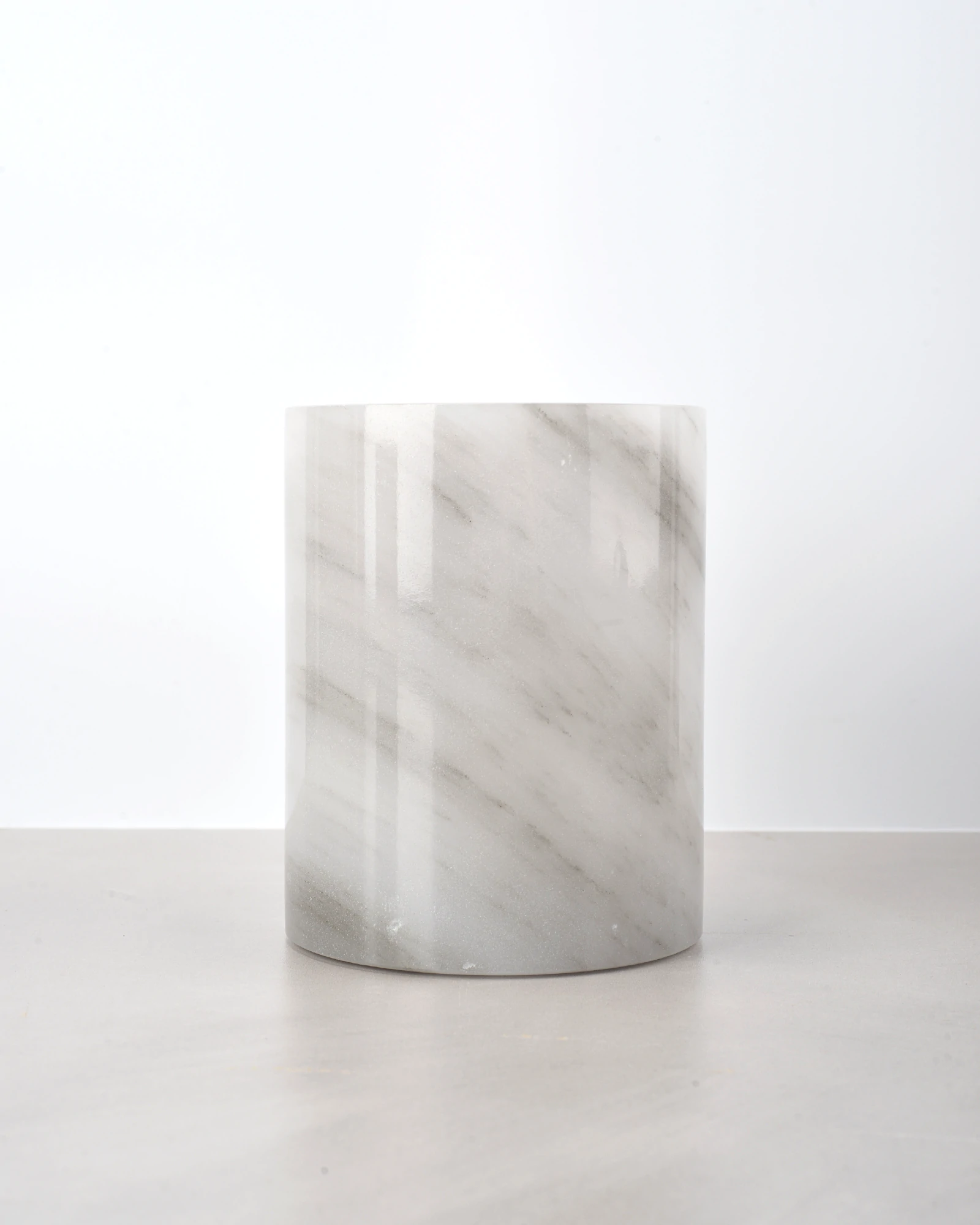 Sparkling mineral crystals on grey onyx surface reflecting light