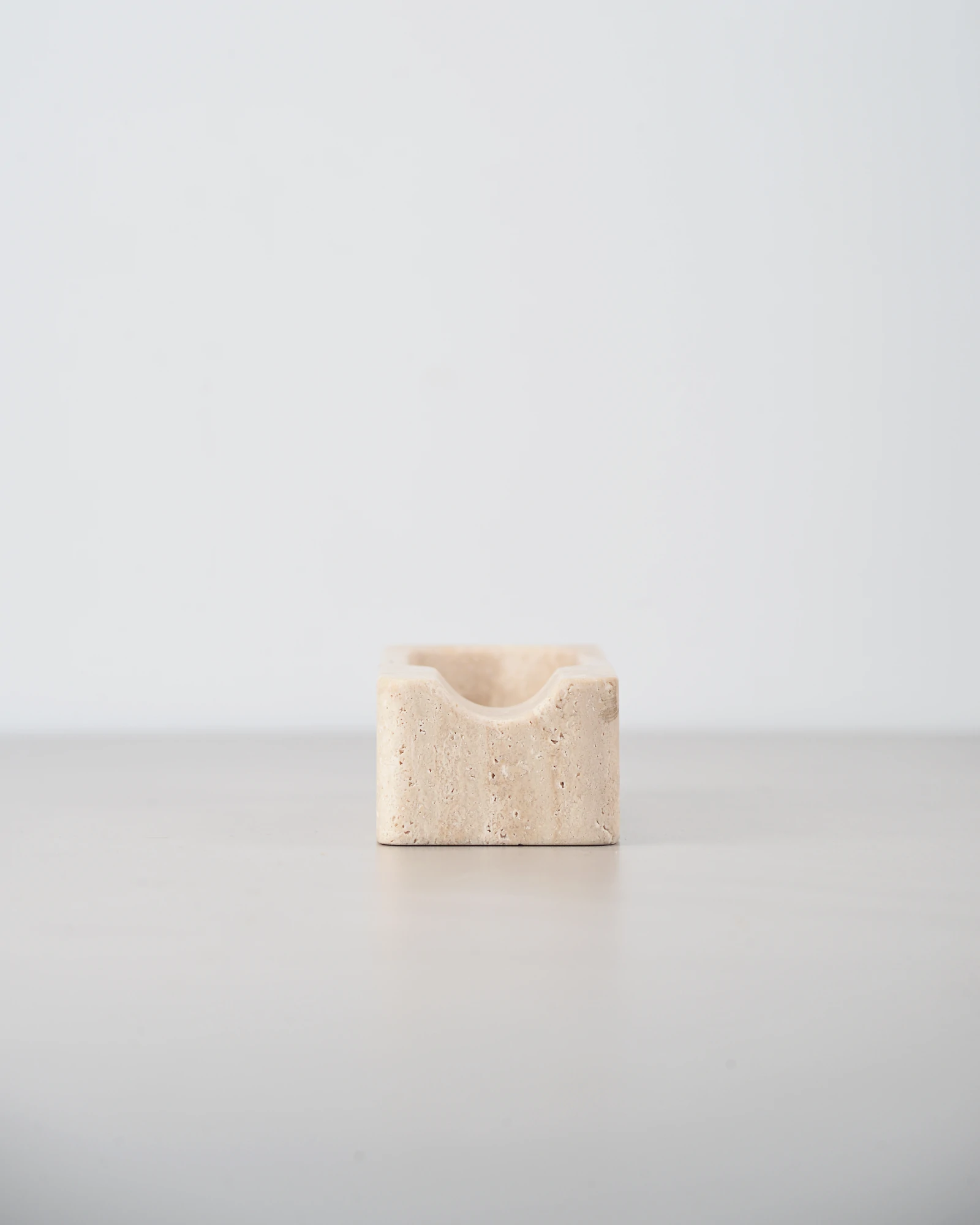 Close-up of cigar ashtray with curved notch for cigar placement