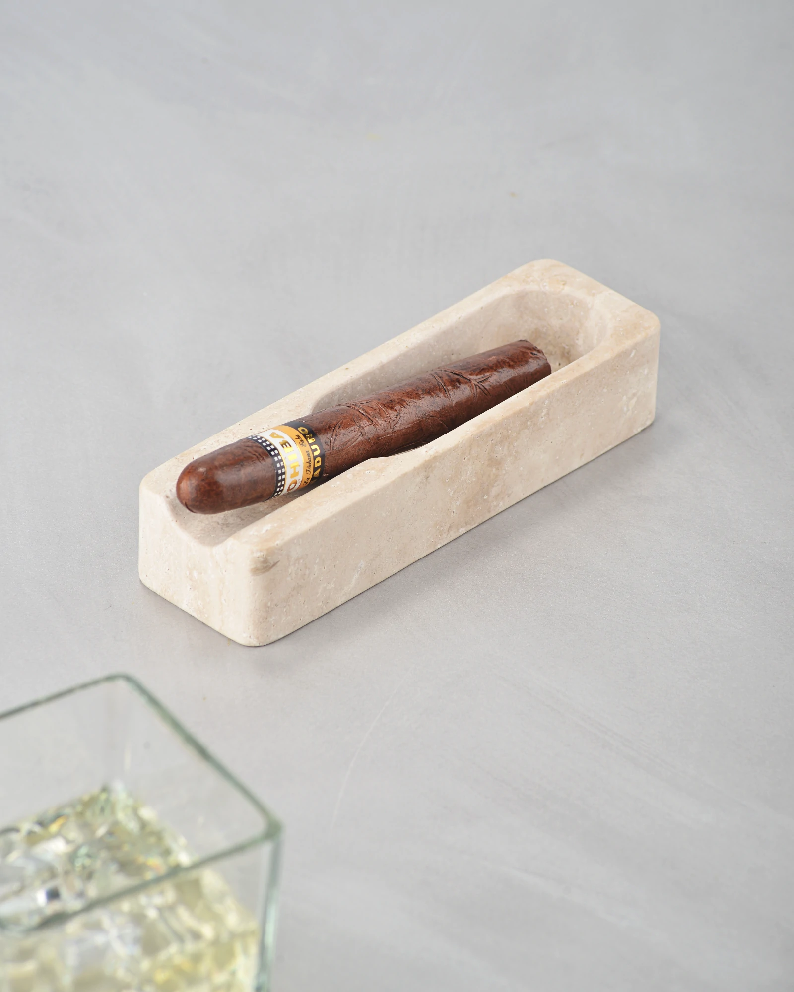 Travertine cigar ashtray displayed as decorative home accessory on tabletop