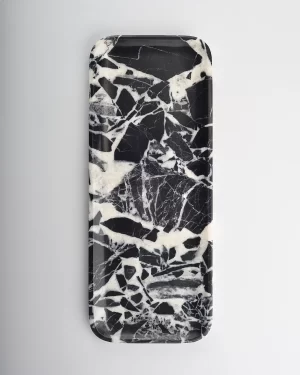 Black marble tray with fine, intricate white veining