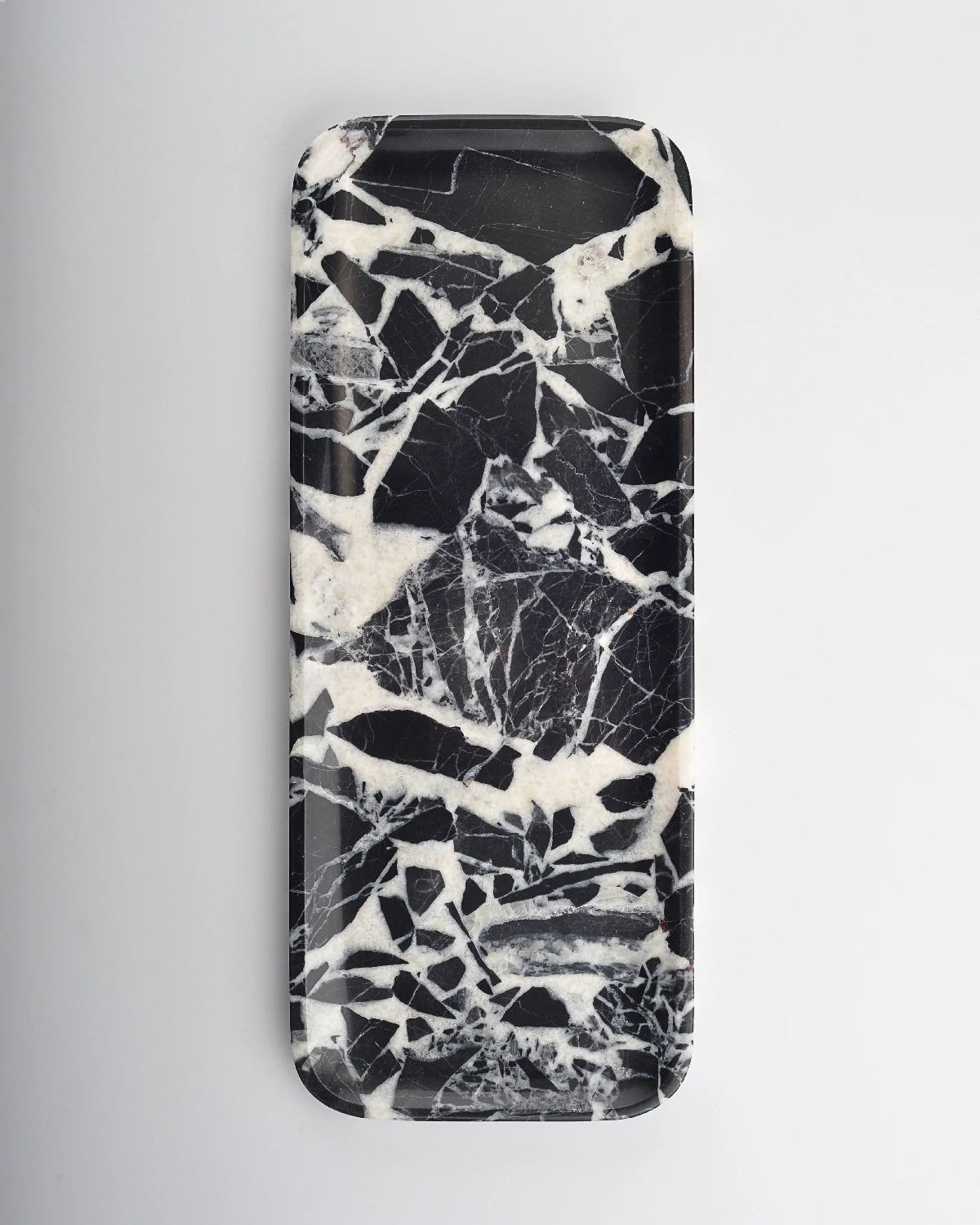 Black marble tray with fine, intricate white veining