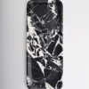 Top view of black marble tray with white web-like veining at center