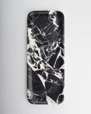 Top view of black marble tray with white web-like veining at center