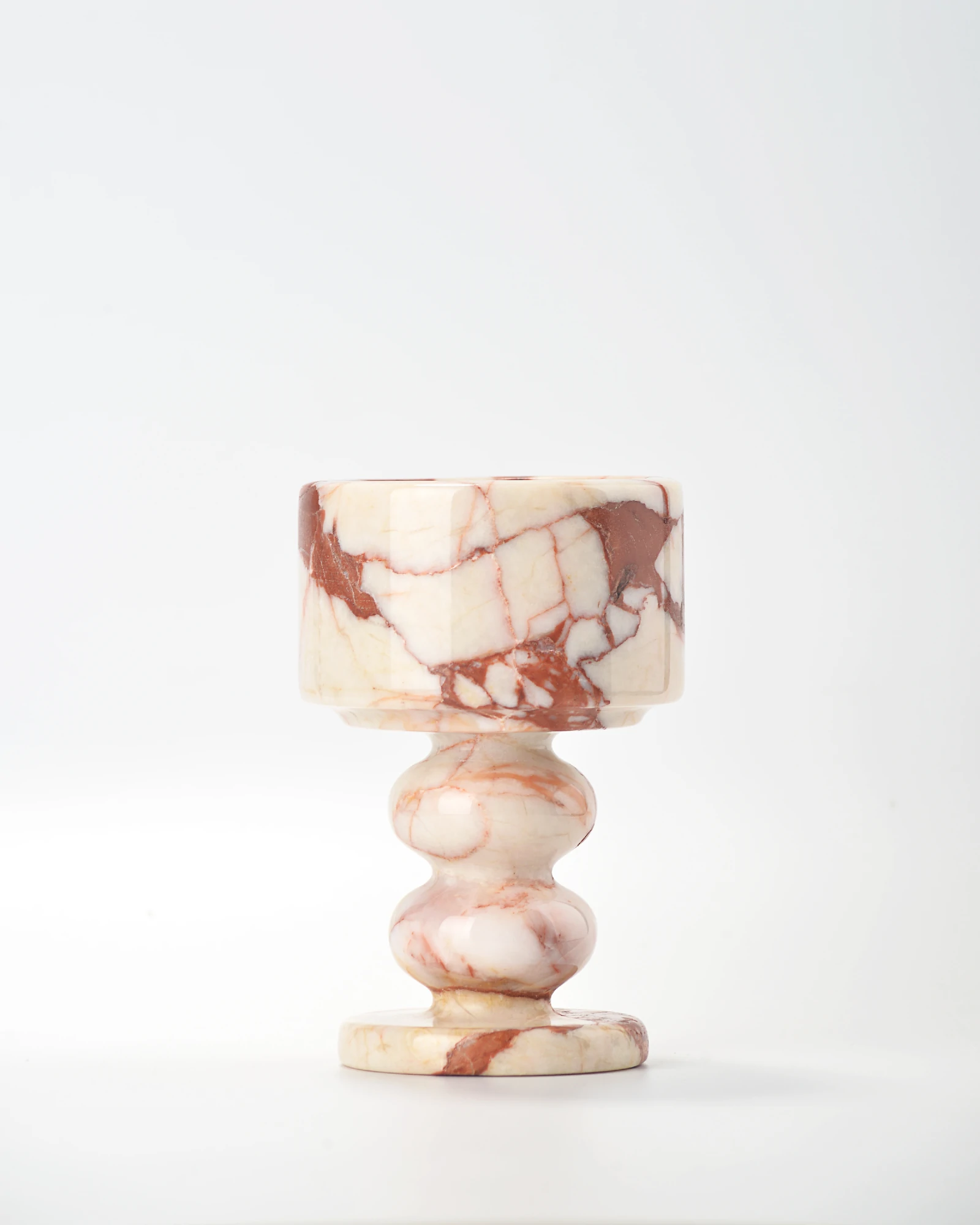 Bvlgari Red Marble Candle Holder with subtle veining and dominant ivory tone