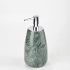 Side angle of large green marble soap dispenser showing form and texture