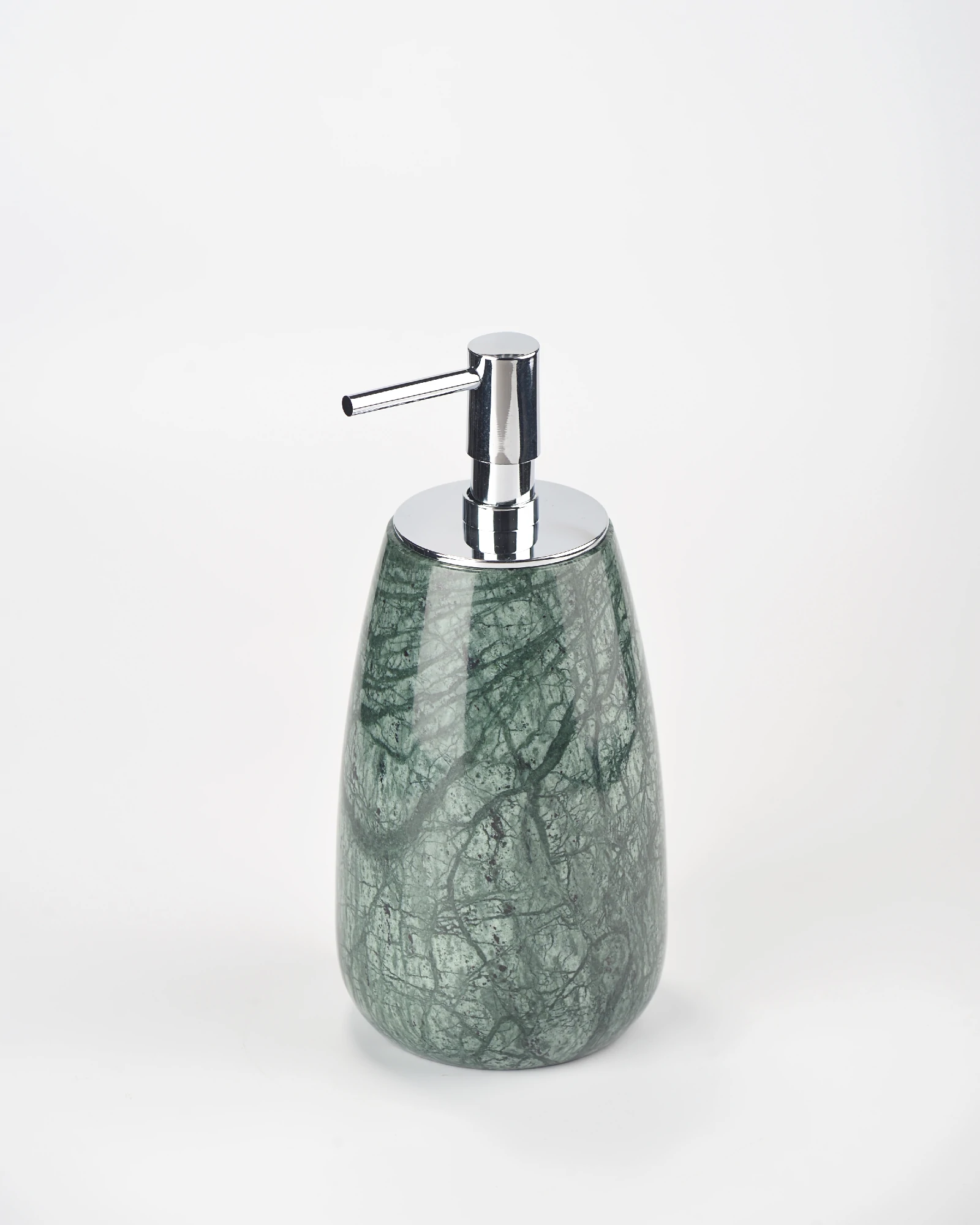 Side angle of large green marble soap dispenser showing form and texture