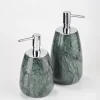 Green marble soap dispensers with chrome-finish pump heads under lighting