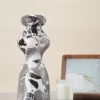 Black & White Marble Vase on table with candle and photo frame