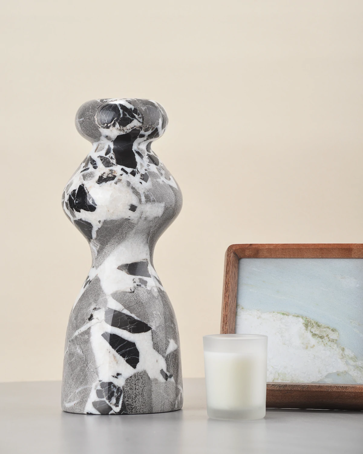 Black & White Marble Vase on table with candle and photo frame