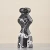 Rear of marble vase with similar black and white contrast as front