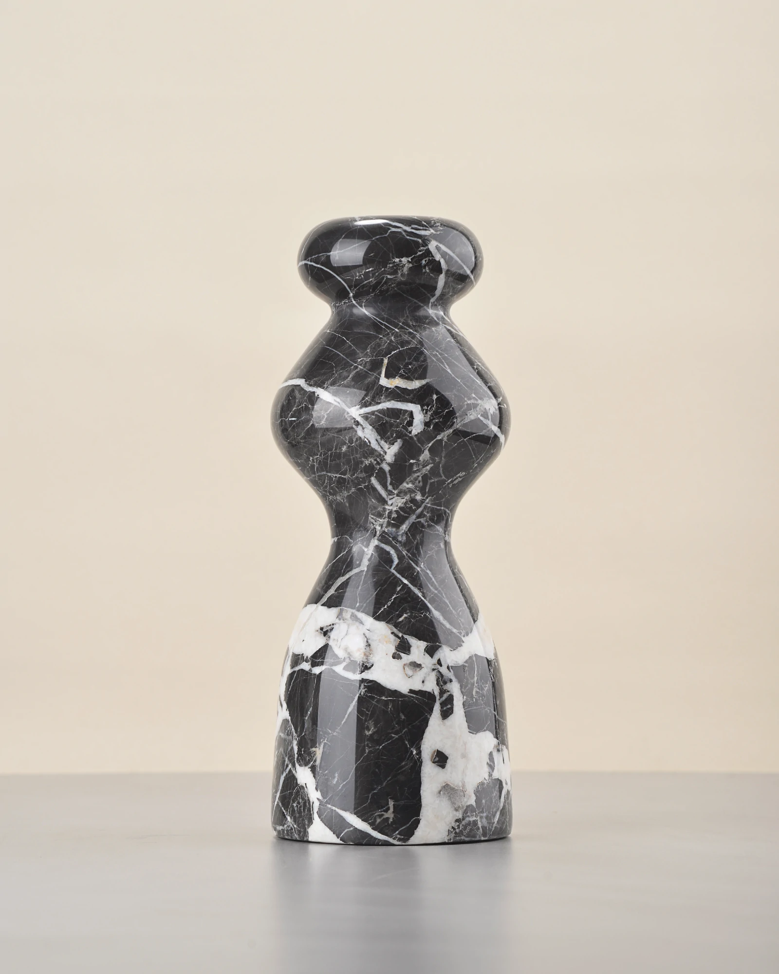 Rear of marble vase with similar black and white contrast as front