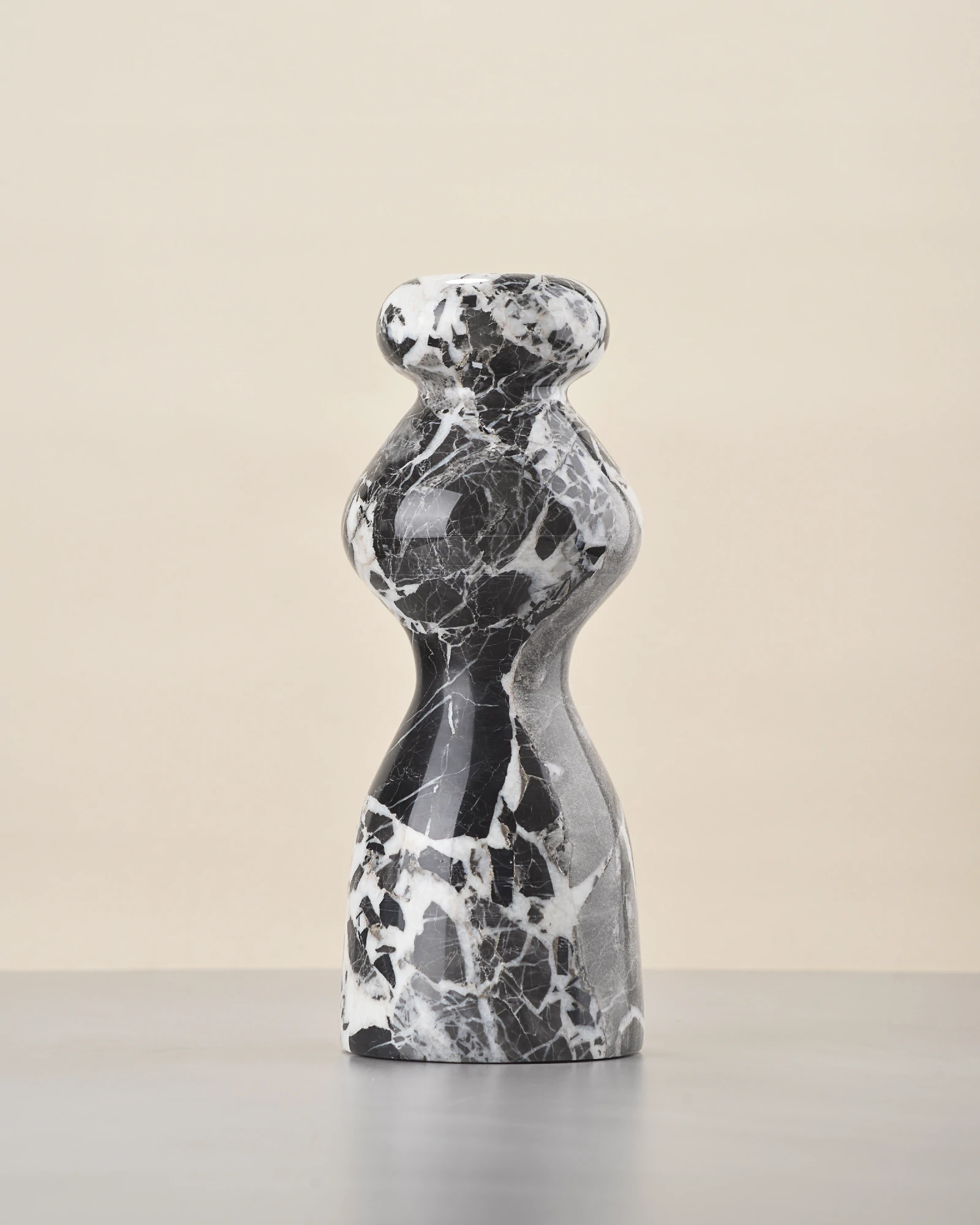 Back of marble vase showing dominant black stone block