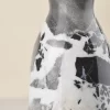 Marble vase surface glowing under light with polished sheen