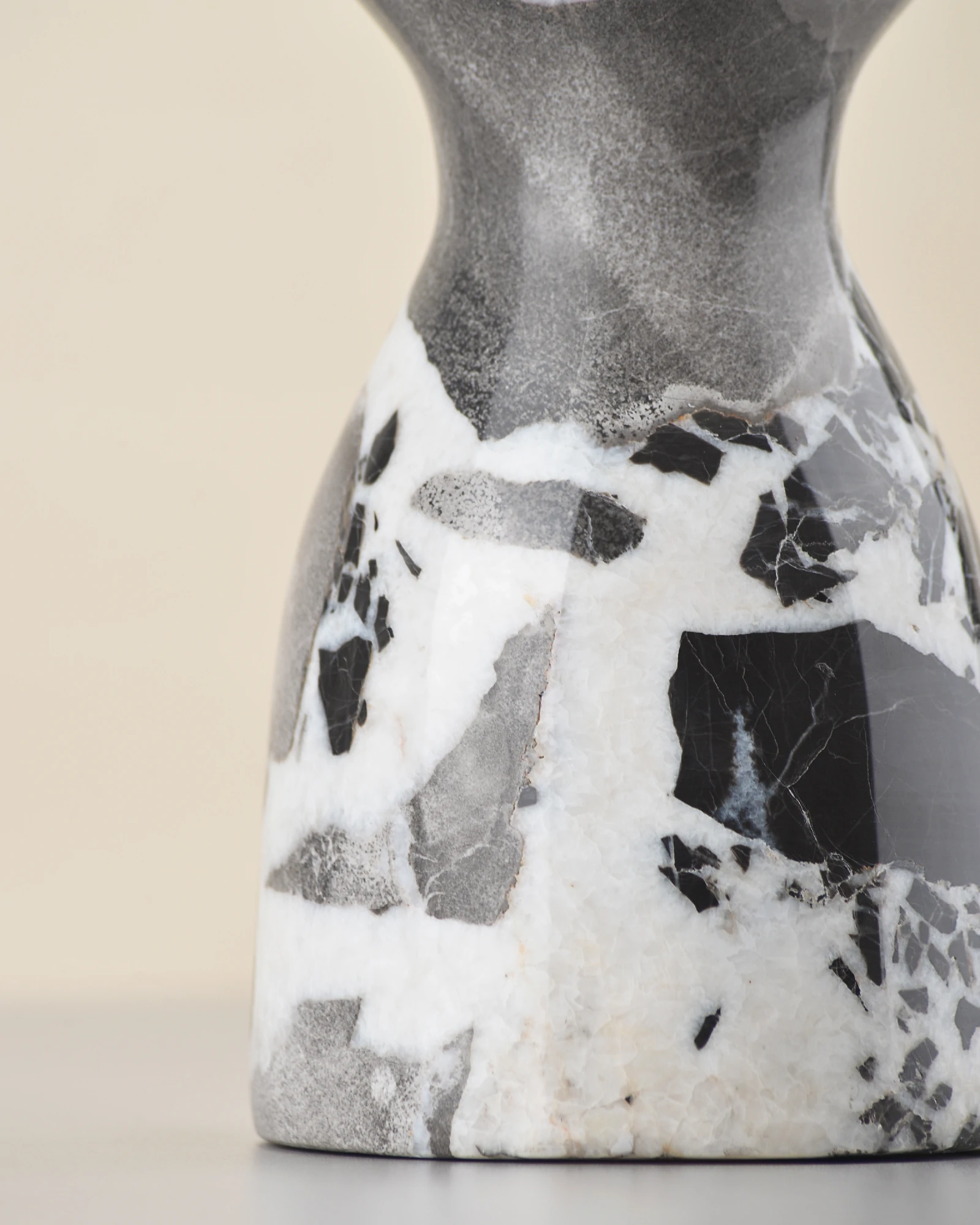 Marble vase surface glowing under light with polished sheen