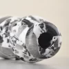 Side view of marble vase showing curved sculptural form