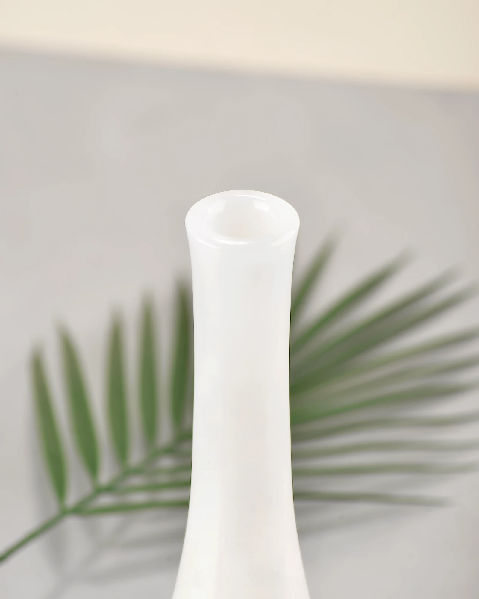 Polished rim detail of white onyx marble decorative vase