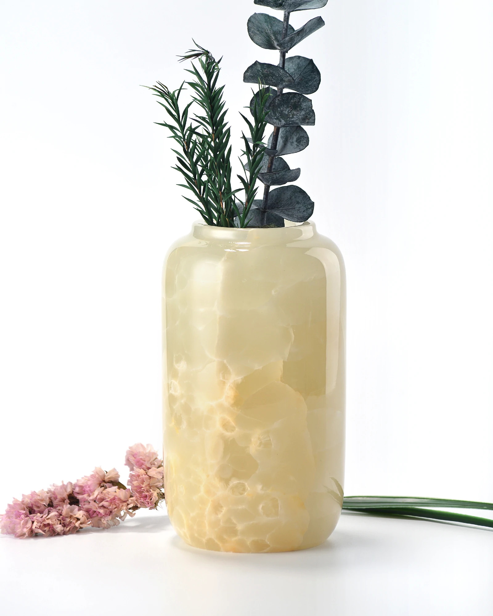 Small green onyx vase with green dried flowers and pink floral accent