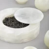 Semi-translucent onyx canister subtly showing tea leaves inside