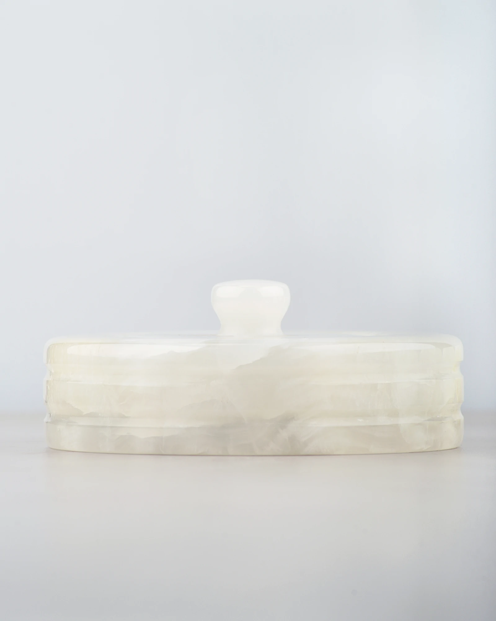 Front view of vintage onyx canister jar with palace-inspired silhouette