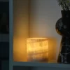 Mini Yellow Onyx Lamp glowing in dark room corner